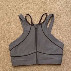 Zip up high neck sports bra